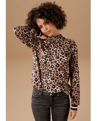 Aniston CASUAL - Langarmshirt mit trendigem Animal-Print und gestreiften Bündchen - Lyst