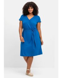 Sheego - Jerseykleid Große Größen in Wickeloptik mit raffiniertem Rückenausschnitt - Lyst