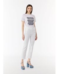 comma casual identity - Stoffhose Regular Fit: Cropped Jeans mit Flared Leg Garment Dye - Lyst
