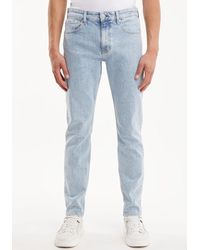 Calvin Klein - Tapered-fit-Jeans SLIM TAPER mit Calvin Klein Leder-Badge - Lyst