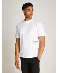 Calvin Klein - OFF PLACEMENT LOGO T-SHIRT mit Logoschriftzug - Lyst