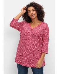 Sheego - 3/4-Arm-Shirt Große Größen mit Blumendruck und V-Ausschnitt - Lyst