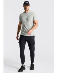 Under Armour - Jogginghose Ua Rival Fleece Cargo Jogger Mit Superweicher Innenseite, Aus Baumwolle Und Polyester - Lyst