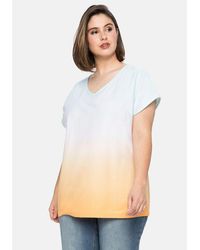 Sheego - T-Shirt Große Größen in Batik-Optik und mit V-Ausschnitt - Lyst