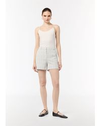 Comma, - Chinoshorts Bouclé-Jerseyshorts mit Metallic-Garn - Lyst