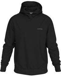 Calvin Klein - Kapuzensweatshirt ENLARGED BACK LOGO HOODIE mit Logodruck - Lyst