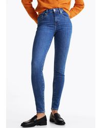 Tommy Hilfiger - Fit-Jeans HERITAGE (TH FLEX COMO SKINNY RW) mit Logo-Badge - Lyst