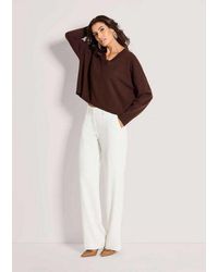 Madeleine - Strickpullover Oversize-Pullover Mit V-Ausschnitt Basicpulli Mit Verlängertem Rücken, Rippenabschlüssen Und Langarm - Lyst
