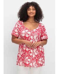 Sheego - T-Shirt Große Größen mit Blumendruck und V-Ausschnitt - Lyst