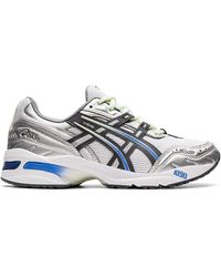 white asics trainers