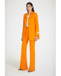 Patou - Button-Hem Flared Trousers - Lyst