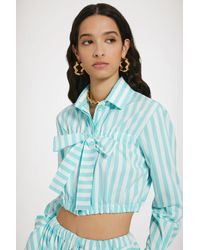Patou - Kurze Bluse mit Schleife aus bedruckter Baumwolle - Lyst