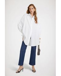 Patou - Robe chemise courte en coton bio - Lyst