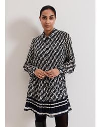 Phase Eight - Petite Eleanor Geo Swing Pleated Dress - Lyst