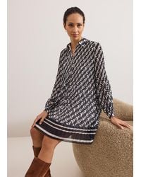 Phase Eight - Eleanor Geo Swing Pleated Dress - Lyst