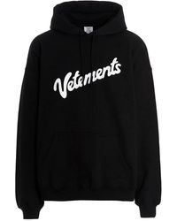 Femme Vêtements Articles de sport et dentraînement Sweats à capuche Hoodie oversize à logo imprimé Coton ANREALAGE en coloris Noir 