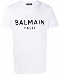 White Balmain Written Logo Print Cotton Jersey T-shirt in White/Black for Men Mens Clothing T-shirts Short sleeve t-shirts 