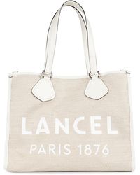 LANCEL Sac fourre-tout 25cm en veau grainé rouge, agrémenté d'un patch,  fermeture [] | lot 58 | Vêtements - Chaussures - Accessoires -  Maroquinerie - Bijoux - Haute couture at Azur Enchères