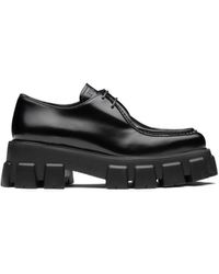 Damen Schuhe Flache Schuhe Schnürschuhe und Schnürstiefel Prada Leder Schnürschuhe mit Leoparden-Print in Schwarz 