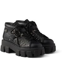 Prada - Monolith Studded Leather Booties, Size 35 - Lyst