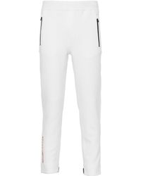Prada - Logo-Print Tapered Trousers - Lyst