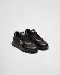 Prada - Re-nylon Brand-plaque Leather And Recycled-nylon Low-top Trainers - Lyst