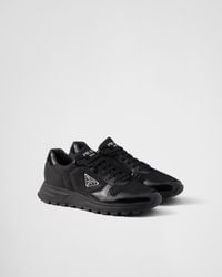 Prada - Re-Nylon Brand-Plaque Leather And Nylon Low-Top Trainers - Lyst