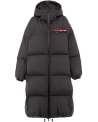 Prada - Oversized Technical Re-Nylon Down Coat - Lyst