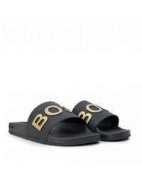 black and gold hugo boss sliders