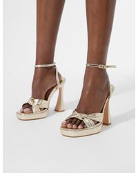 Public Desire - Trendsetter Cracked Gold Pu Knot Detail Flare Platform Heels - Lyst