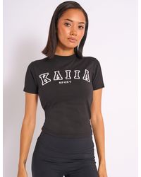 Public Desire - Kaiia Sport Logo Longline Baby Tee Black - Lyst