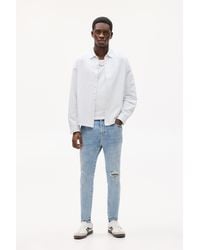 Pull&Bear - Ripped Carrot Fit Jeans - Lyst