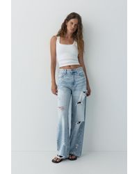 Pull&Bear - Ripped Baggy Jeans With Rhinestones - Lyst