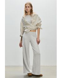 Pull&Bear - Broek Met Wijde Pijpen Van Soft Touch Materiaal - Lyst