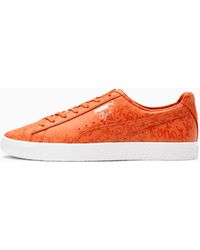 orange puma shoes
