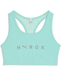 PUMA - X Hyrox Mid Sports Bra - Lyst
