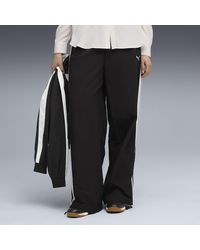 PUMA - Pantalones De Chándal T7 Tejidos De Corte Holgado Para Mujer, Ropa, Negro - Lyst