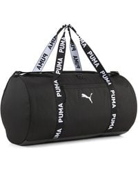 PUMA - Bolsa Cilíndrica Essentials Training 28,5 L, Accesoiros, Negro - Lyst
