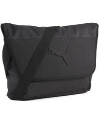 PUMA - Bolso Estilosajero Buzz 6 L, Accesoiros, Negro - Lyst