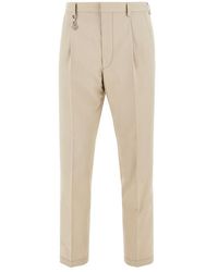 Prada - Cotton Pants With Triangle Logo Charm - Lyst
