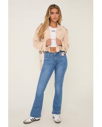 Rebellious Fashion - Bright Stretch Mid Waist Kick Flare Denim Jeans - Lyst