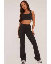 Rebellious Fashion - Ruched Back Flared Leg Trousers - Lyst