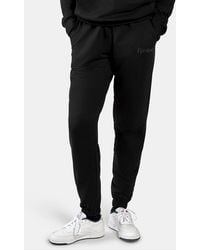 Reebok - Studded Logo Pants - Lyst