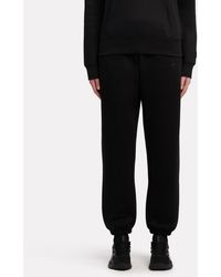 Reebok - Satin Logo Fleece Pants - Lyst