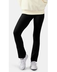 Reebok - Tara Small Logo Flared Leggings - Lyst