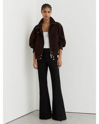 Reiss - Petite Button-Detail Flared Jeans - Lyst