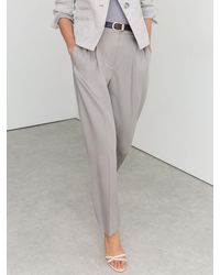 Reiss - Petite Lyocell Tapered Pleated Trousers - Lyst
