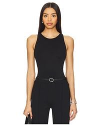 Spanx - Camiseta Tirantes Espalda Deportiva Smoothing Jersey En Color Negro Talla (También En S, Xl, Xs) - Lyst