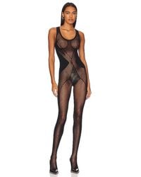 Wolford - CATSUIT ROMANCE NET - Lyst