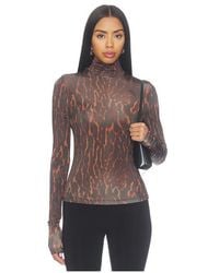 Ganni - Printed Shiny Jersey Turtleneck Top - Lyst
